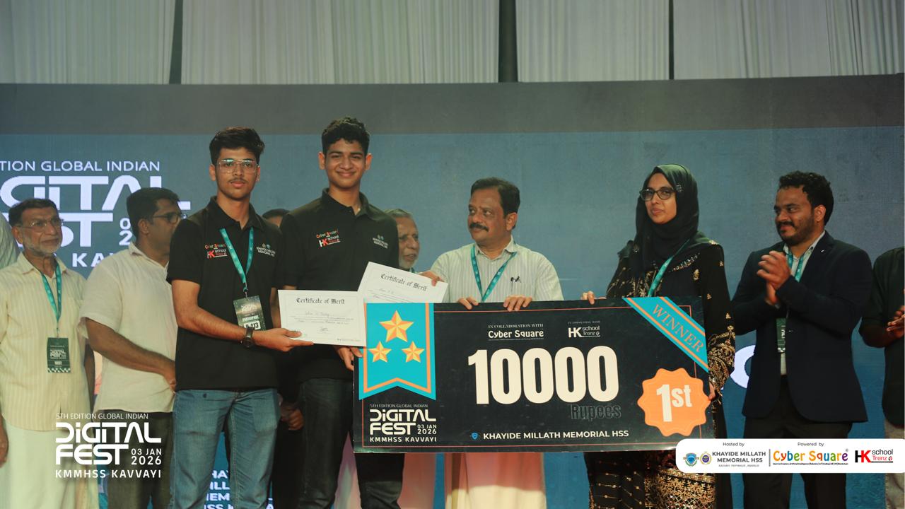 Alan Betty and teammate holding the winner cheque and certificates of merit at the 5th edition Global Indian Digital Fest, KMMHSS Kavvayi