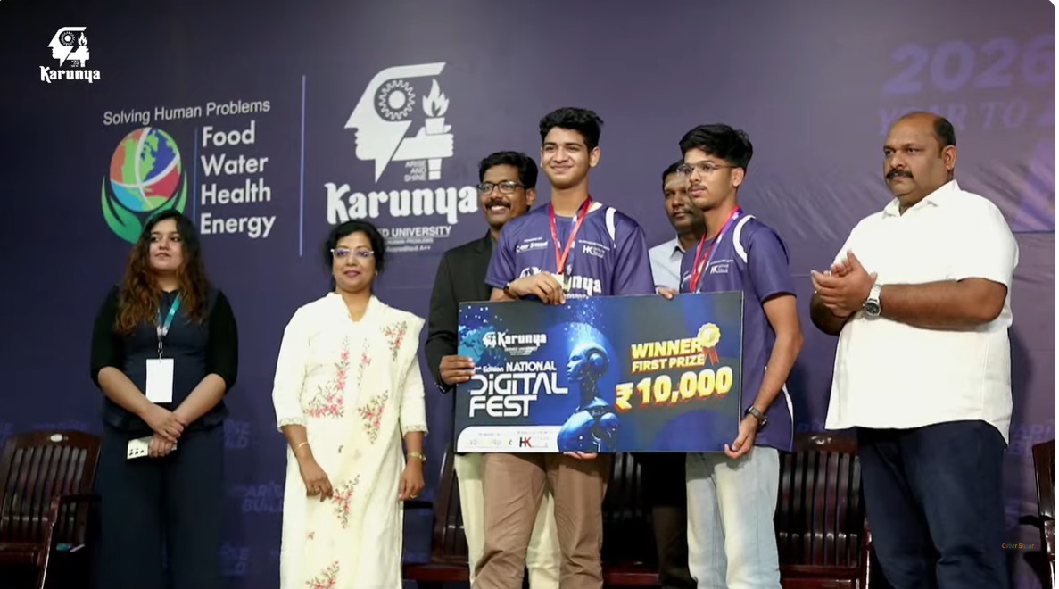 Alan Betty and teammate receiving the first prize cheque on stage at the National Digital Fest, Karunya Institute of Technology and Sciences